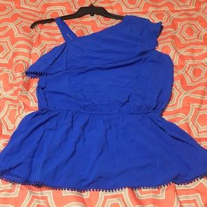 NWT. Kaari Blue one shoulder top with dot trim.